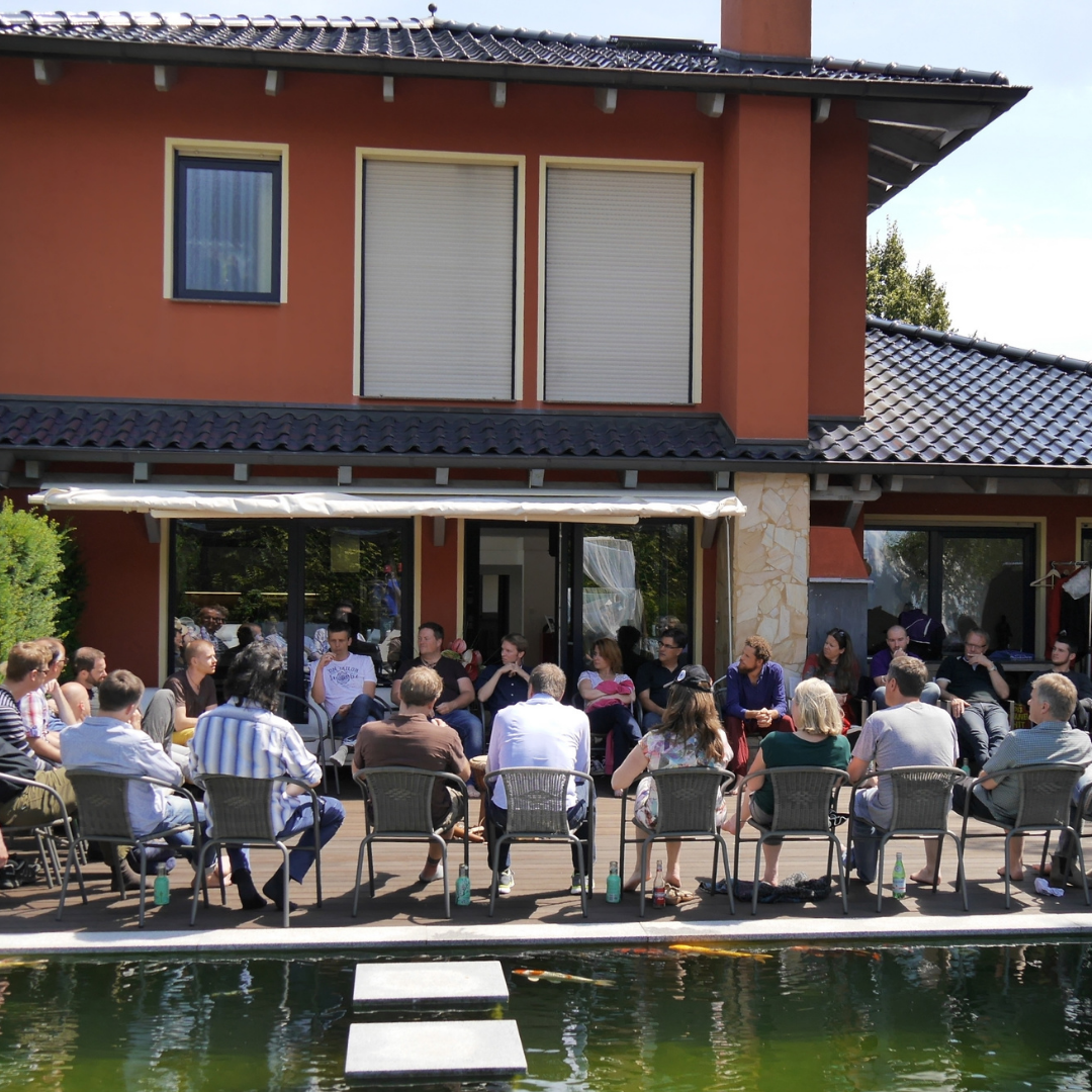 Practitioners gathered in a circle at the Beyond Leadership academy